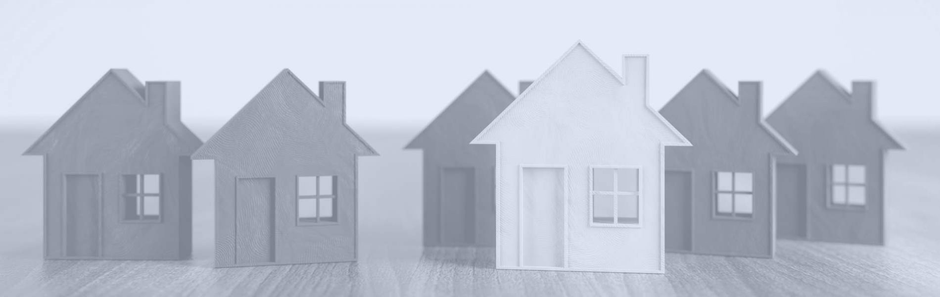 Miniatur-Hausfassaden aus Holz aufgereiht bildlich Immobilienrecht Rechtsanwalt 